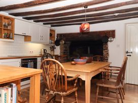 A kitchen with a dining table and chairs at Hope Cottage in Riddlecombe, near Winkleigh