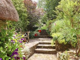 A garden with stairs and plants at Hope Cottage, Riddlecombe, near Winkleigh
