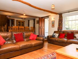 A living room with sofas and a dining area at East Bickleigh in Halwell