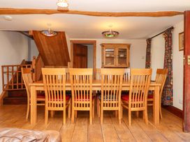 A dining room with a table and chairs at East Bickleigh in Halwell