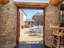 An outdoor view through a doorway at East Bickleigh in Halwell
