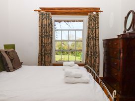 A bedroom with a bed, pillows, and a chest of drawers at East Bickleigh in Halwell