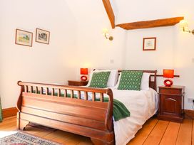 A bedroom with a bed and bedside tables at East Bickleigh in Halwell