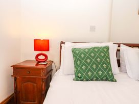 A bedroom with a bed and bedside table at East Bickleigh in Halwell