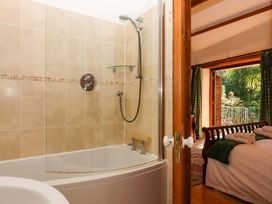 A bathroom with a shower and bathtub at East Bickleigh Halwell