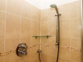 A shower with glass shelf and controls at East Bickleigh in Halwell