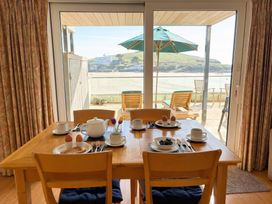 A dining room with a table set for breakfast at 5 Burgh Island Causeway Bigbury-on-Sea