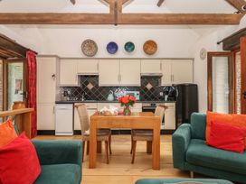A kitchen with a table and chairs at Mixit Cottage in Kingsbridge