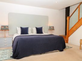 A bedroom with a bed and lamp at Mixit Cottage in Kingsbridge