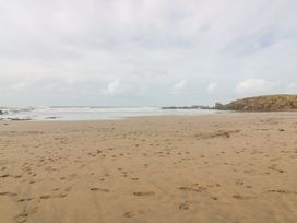 A beach with sand and water at Parnacott in Holsworthy