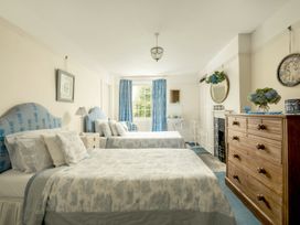 A bedroom with two beds and a chest of drawers at Parnacott in Holsworthy