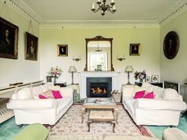 A living room with sofas and a fireplace at Parnacott in Holsworthy