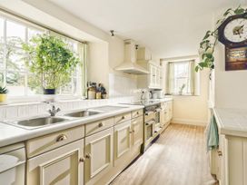 A kitchen with a sink and stove at Parnacott in Holsworthy