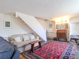 A living room with a sofa and coffee table at Agar Cottage in Trelights, near Port Isaac