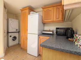A kitchen with appliances and cabinetry at Agar Cottage, Trelights, near Port Isaac