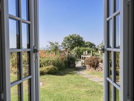 A view of a garden through an open door at Atlantic View in Tintagel