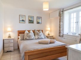 A bedroom with a bed and bedside tables at Atlantic View in Tintagel