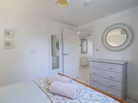 A bedroom with a bed and towels on it at Atlantic View in Tintagel