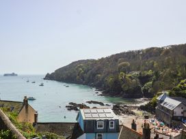 A coastal view with boats and beach at Cousham Cottage in Kingsand And Cawsand