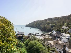 A view of a bay with boats and buildings at Cousham Cottage in Kingsand And Cawsand