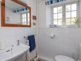 A bathroom with a sink and toilet at Tregonhawke Farmhouse in Millbrook