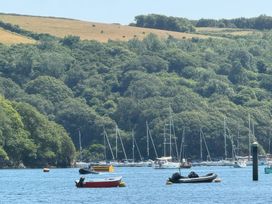 A view of boats on water with greenery and hills at Kingbarth in Lerryn