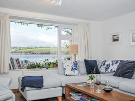 A living room with a sofa and coffee table at Clamoak Cottage Clamoak near Bere Alston