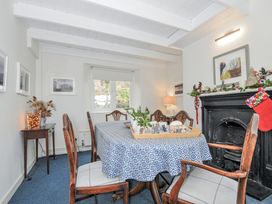 A dining room with a table and chairs at Clamoak Cottage Clamoak near Bere Alston