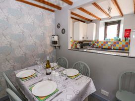 A kitchen with a dining table set at Old Farmhouse Cottage