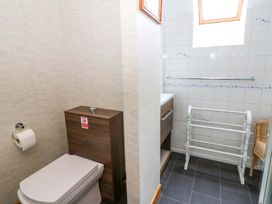 A bathroom with a toilet and sink at Old Farmhouse Cottage