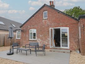 A garden with patio furniture at Sunny Croft in Broadmayne near Dorchester