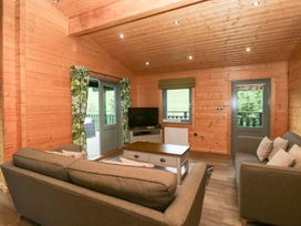 A living room with a sofa and coffee table at Oak Lodge in Pennington near Ulverston