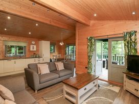 A living room with a sofa and coffee table at Oak Lodge in Pennington near Ulverston
