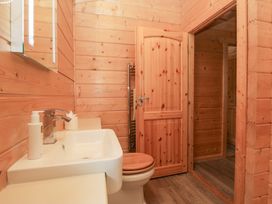 A bathroom with a sink and toilet at Oak Lodge in Pennington near Ulverston