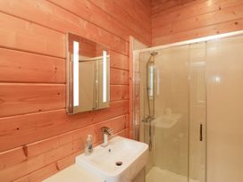 A bathroom with a sink and shower at Oak Lodge in Pennington near Ulverston