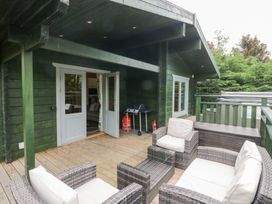 An outdoor area with seating and grill at Oak Lodge Pennington near Ulverston