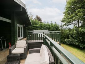 An outdoor balcony with seating at Oak Lodge Pennington near Ulverston