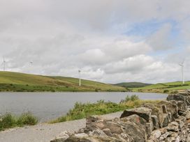 Landscape featuring a lake and wind turbines at Oak Lodge Pennington near Ulverston