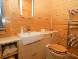 A bathroom with a sink and toilet at Oak Lodge Pennington near Ulverston