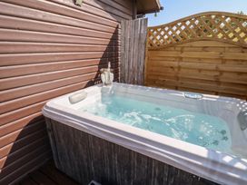 A hot tub in an outdoor area at 16 Badgers Retreat in Richmond