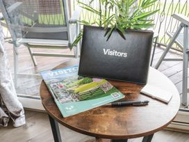 A visitors book and magazine on a table at 16 Badgers Retreat in Richmond