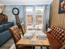 A dining room with a table set for dinner at 16 Badgers Retreat in Richmond