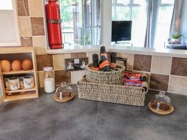 Kitchen countertop with eggs, milk, cups, and a fire extinguisher at 16 Badgers Retreat in Richmond