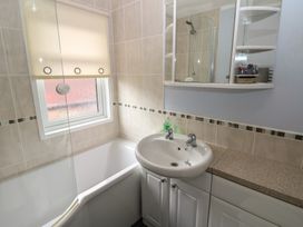 A bathroom with a bathtub and sink at 16 Badgers Retreat in Richmond