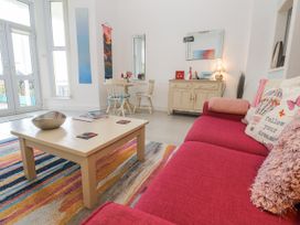 A living room with a coffee table and sofa at Beachcomber in Marazion