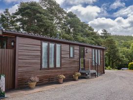 A cottage exterior with steps and planters at The Cabin at East Hill Pride, Four Elms Hill Nr. Sidmouth