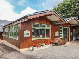 A cafe building with outdoor seating and signage at The Cabin at East Hill Pride Four Elms Hill Nr. Sidmouth