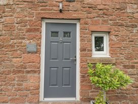 An entrance door and window at Coney Garth Retreat in Beckermet