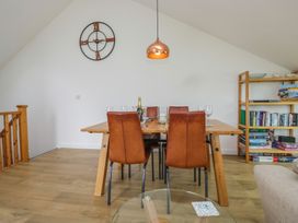 A dining room with a table and chairs at Coney Garth Retreat in Beckermet