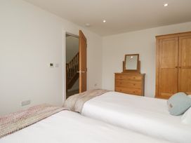 A bedroom with two beds and furniture at Coney Garth Retreat in Beckermet